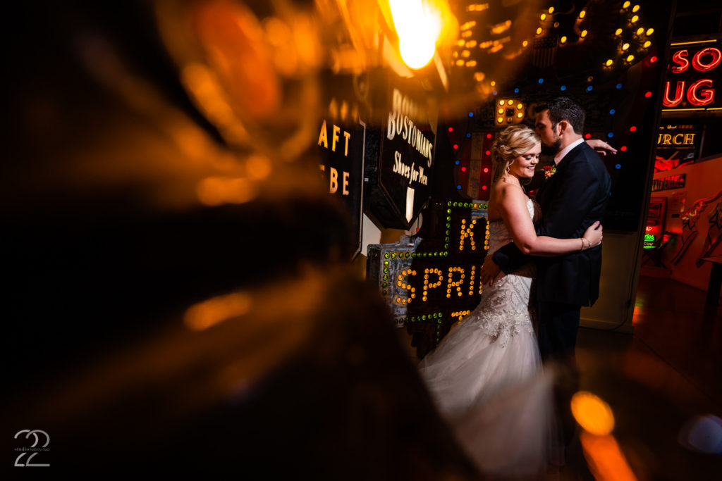 Husband and wife embrace after wedding at the American Sign Museum in Cincinnati by Cincinnati Wedding Photographer Studio 22 Photography